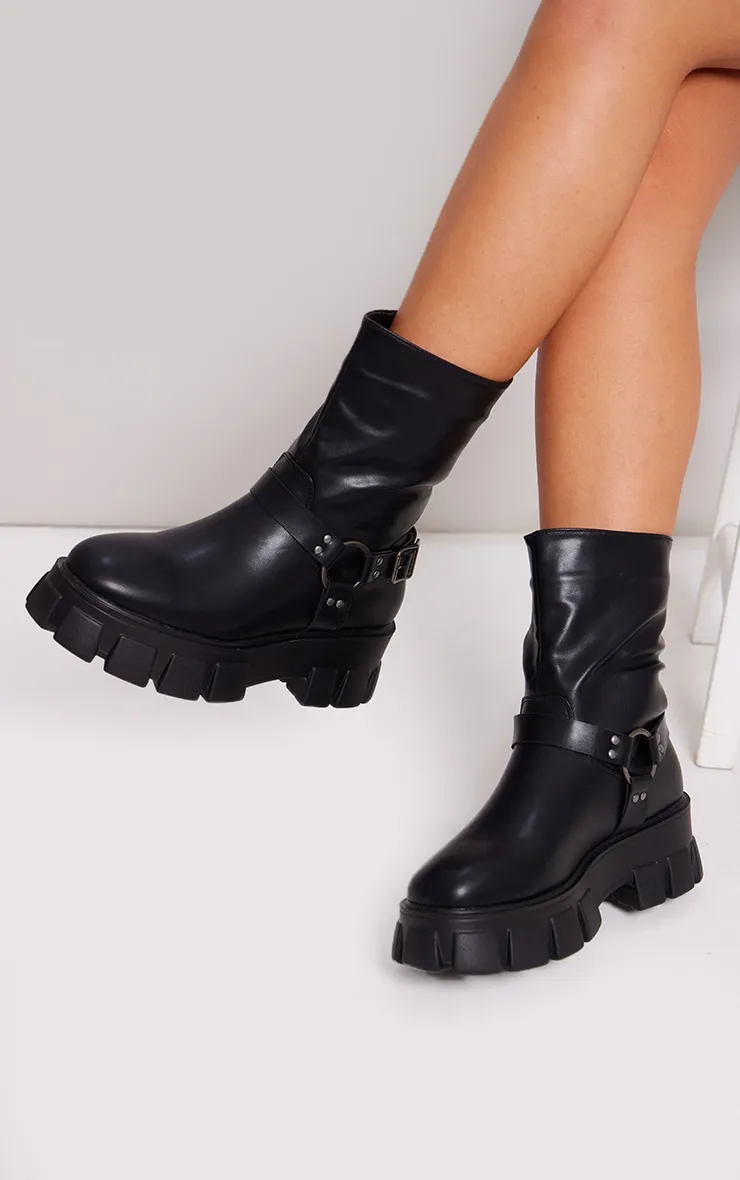Bottines noires chunky à bride bouclée  et semelle ancrée